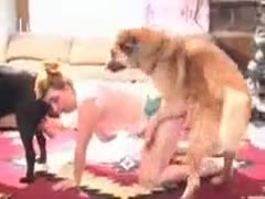 Two animals are gratified at once by a happy married woman.